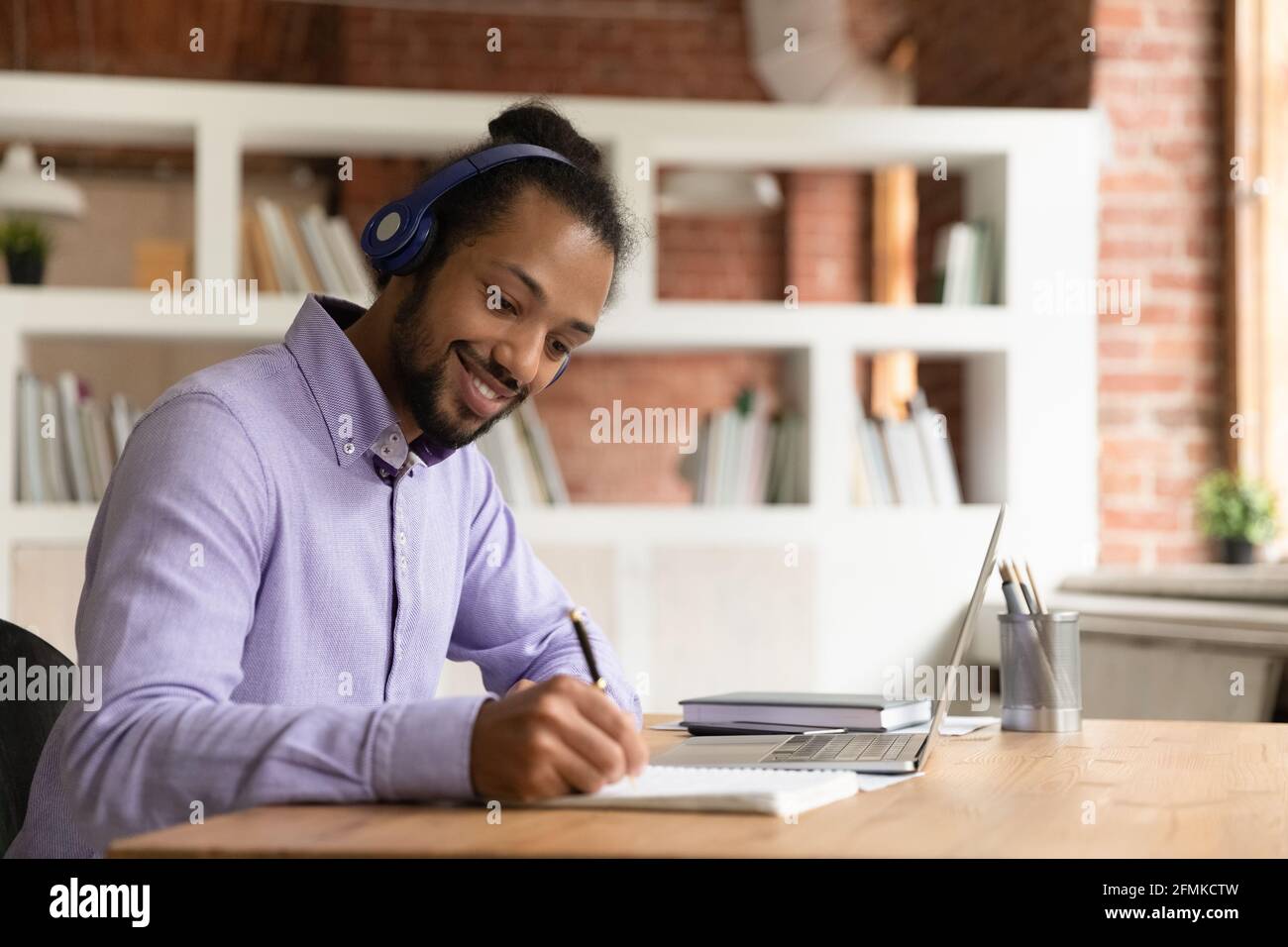 Black man studying at home hi-res stock photography and images - Alamy