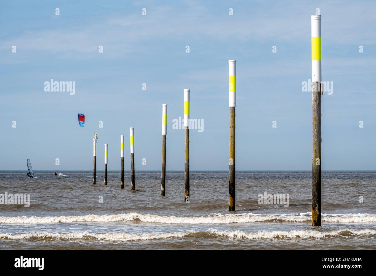 Kiters and surfers off the coast of Peter-Ording Stock Photo