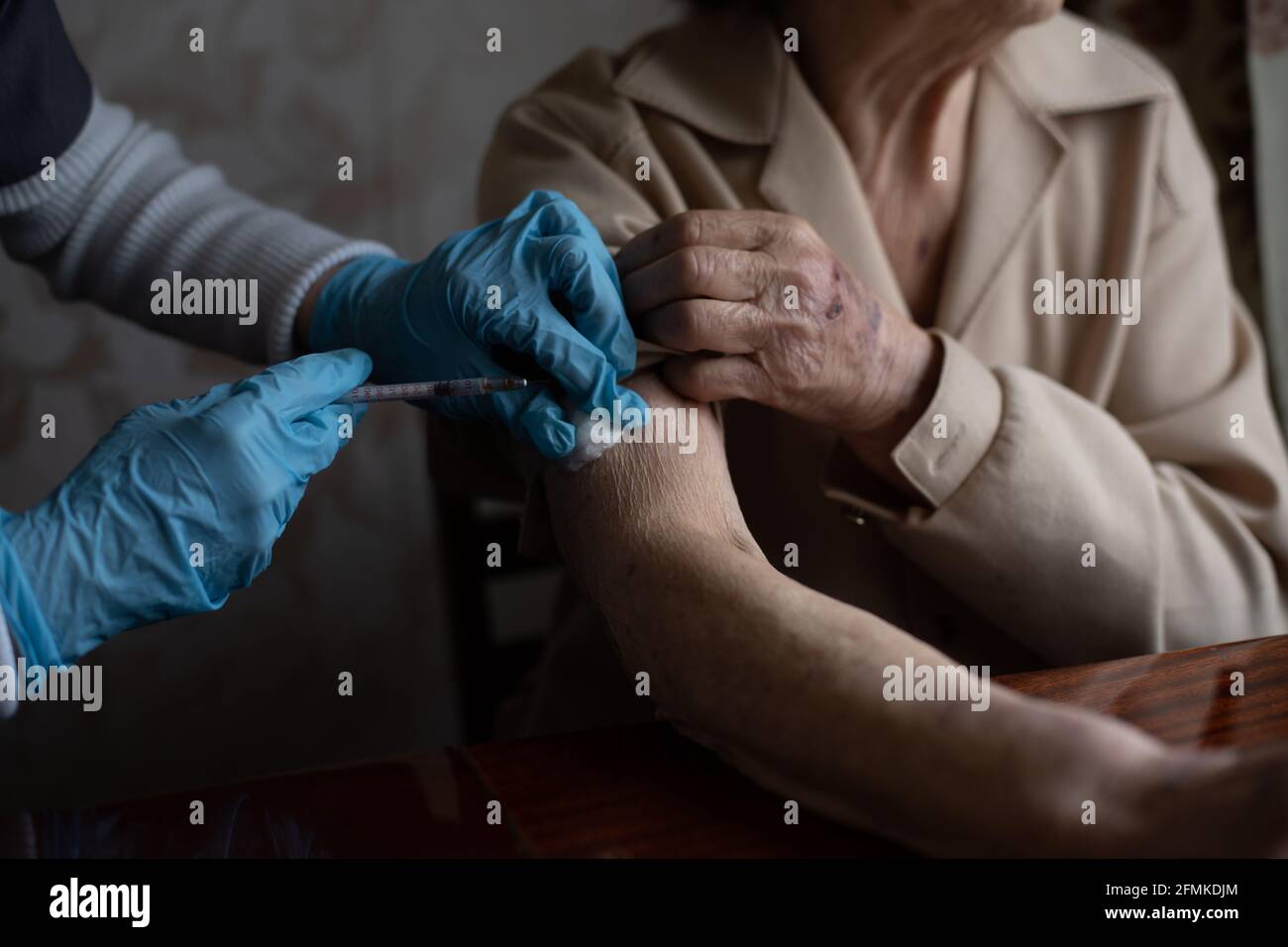 Old Practice Injection The doctor gives old woman's an injection Stock Photo - Alamy