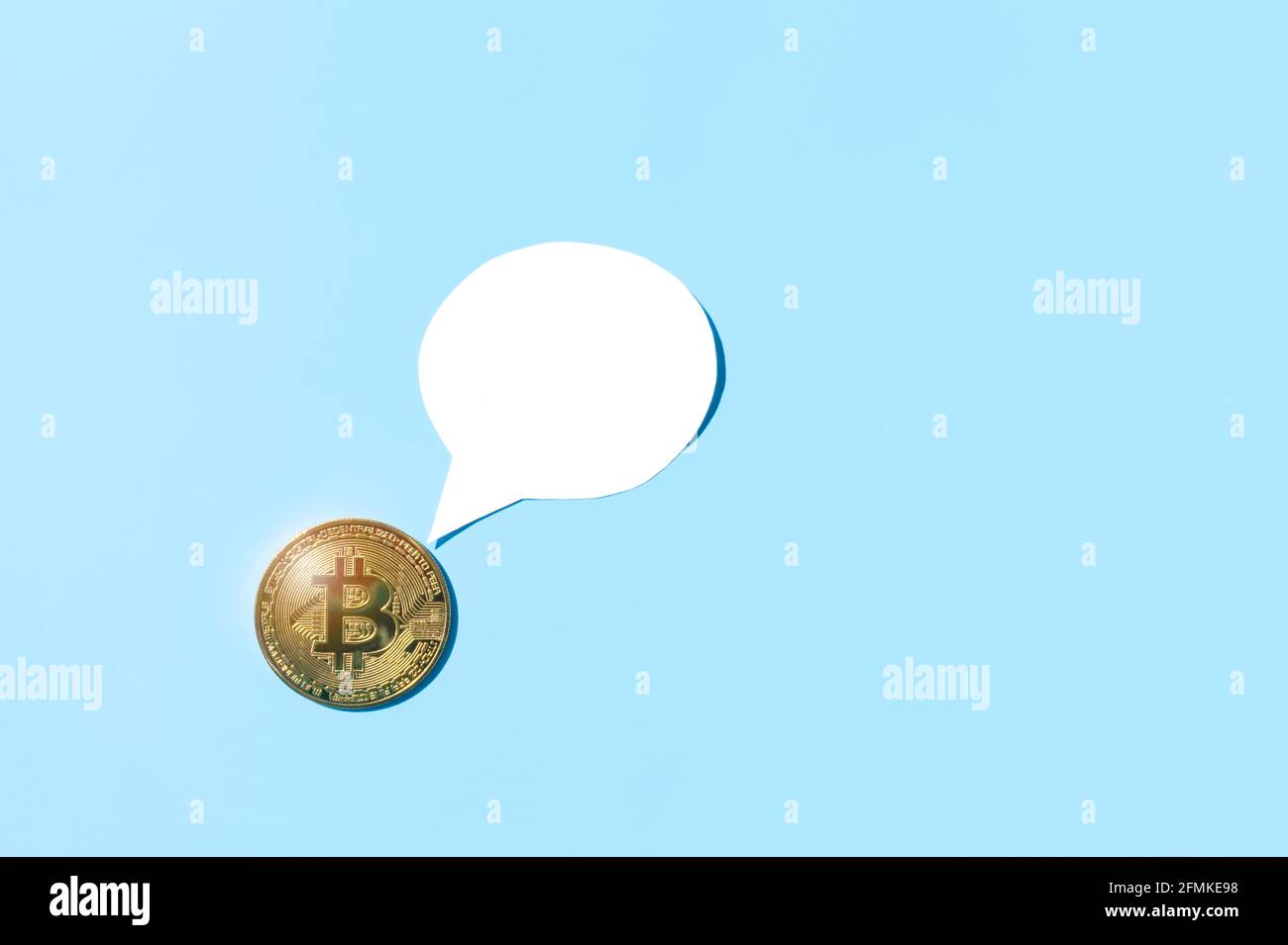 Bitcoin golden coin with paper speech bubble white mockup with copy space  on blue background. Crypto banner with space for text Stock Photo - Alamy