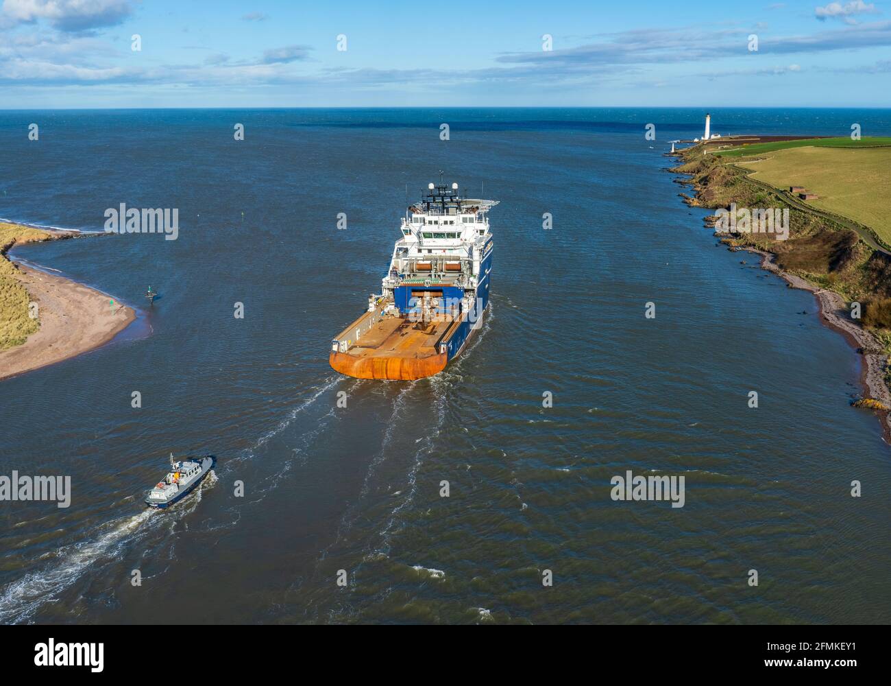 Montrose, Angus, Scotland, UK, 31st of Mar 2017: Offshore support vessel leaving the port of Montrose, oncourse for a North Sea oil rig. Stock Photo