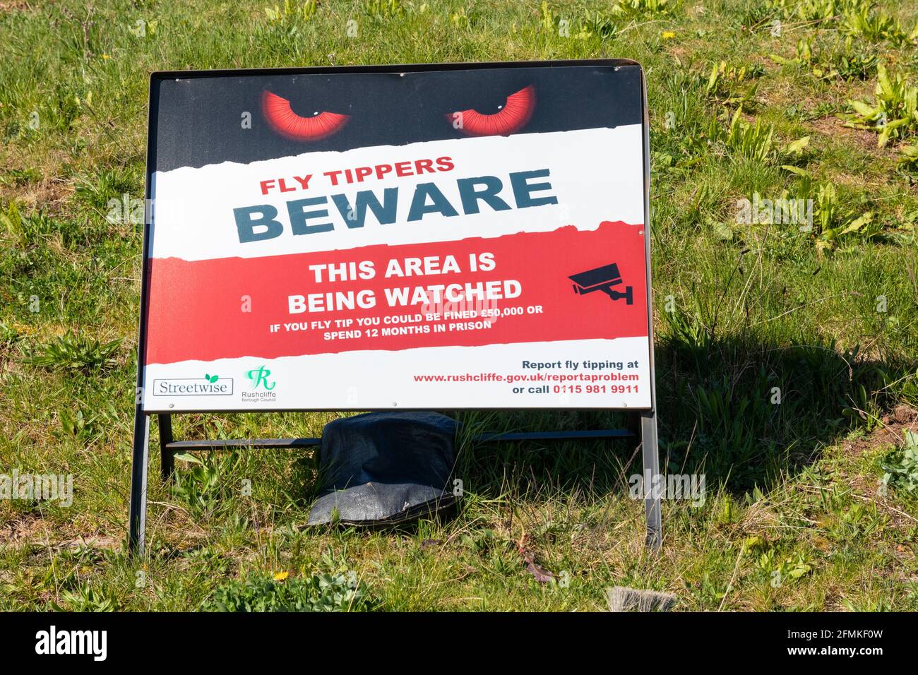 Fly tippers beware sign fly tipping UK countryside Stock Photo