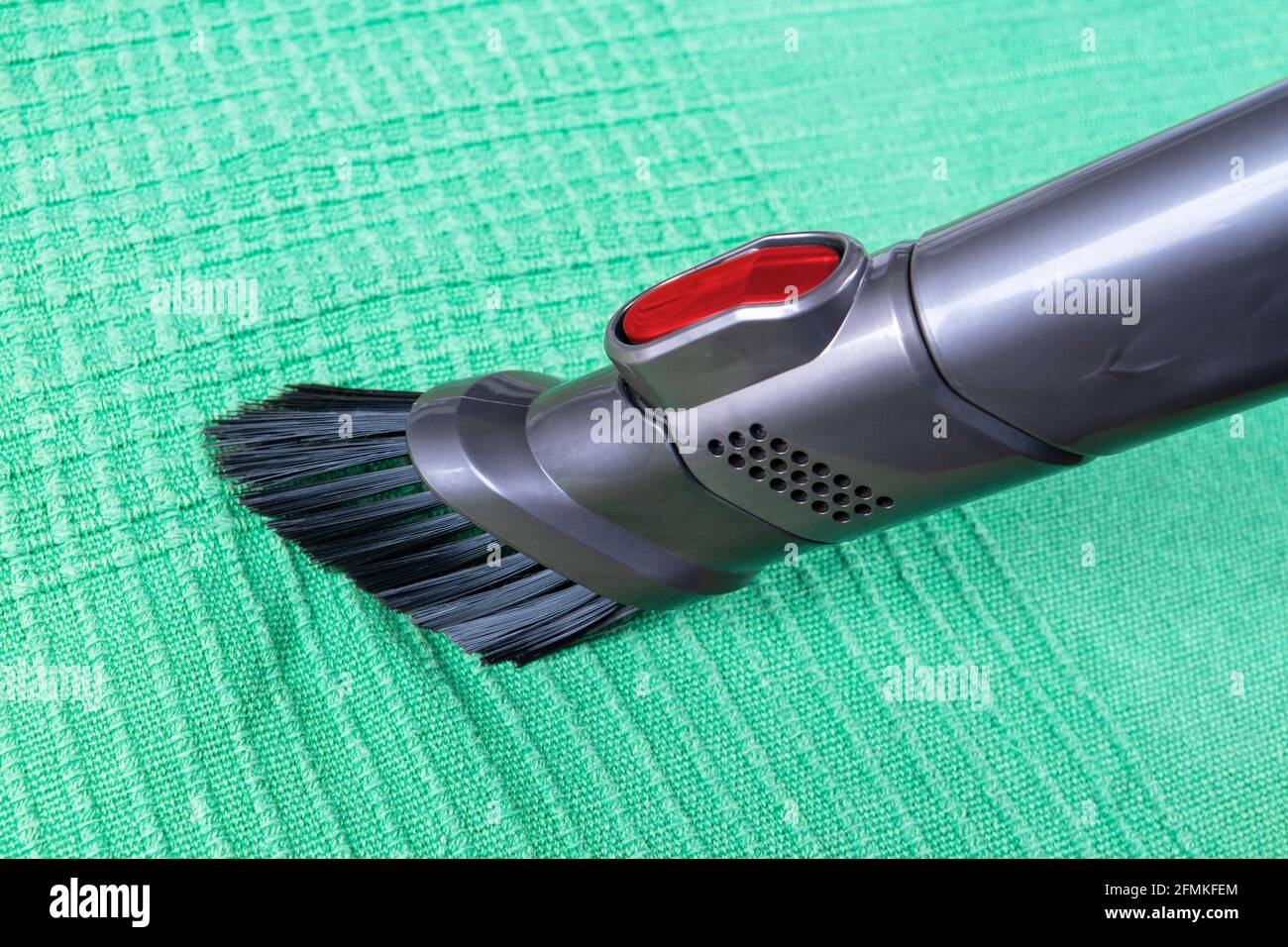 Removing dirt from sofa with upholstery cleaner. Sofa chemical cleaning