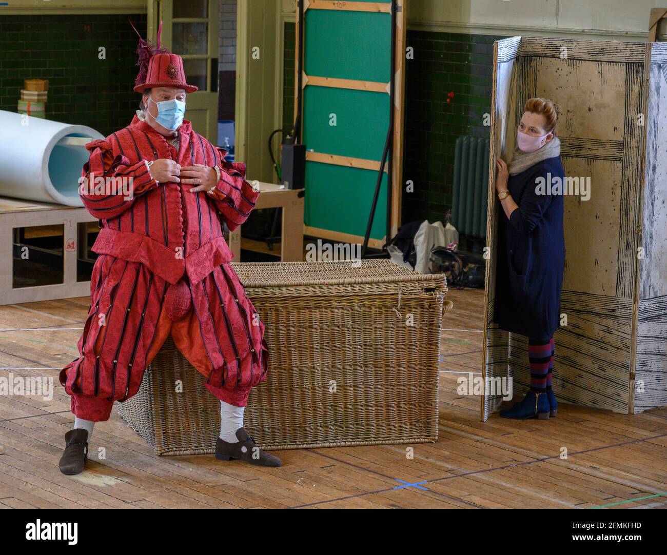 Alford House, London, UK. 10 May 2021. Rehearsals take place in central London for Grange Park Opera Surrey production of Verdi’s comic opera Falstaff with Bryn Terfel and Janis Kelly in masks. The opera starts on 10 June at Grange Park in Surrey and is sold out. Credit: Malcolm Park/Alamy Live News. Stock Photo