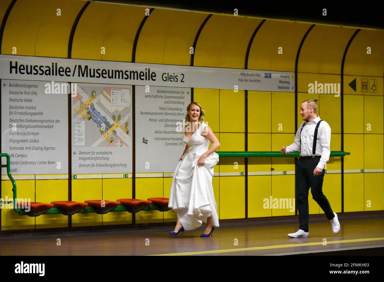 Wedding couple walking on the subway platform Museumsmeile Bonn Stock Photo