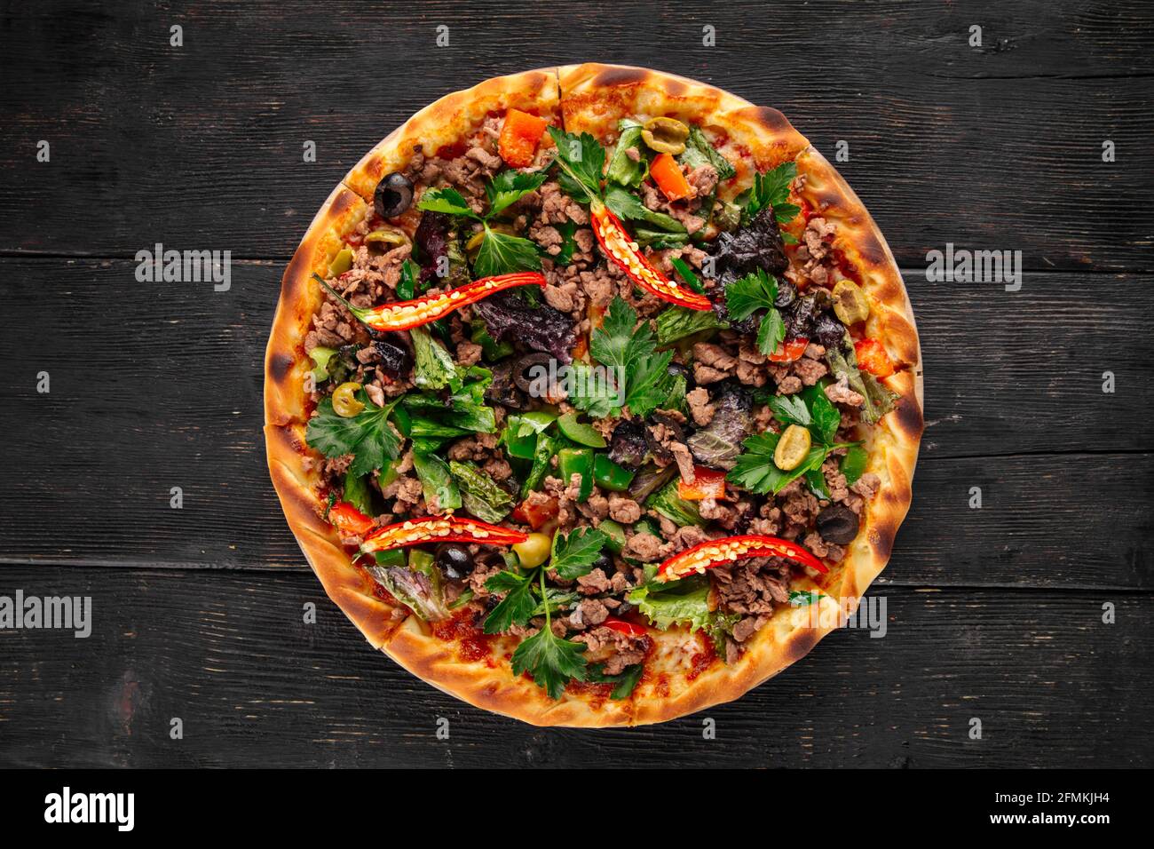 Pizza with spicy peppers and minced meat Stock Photo
