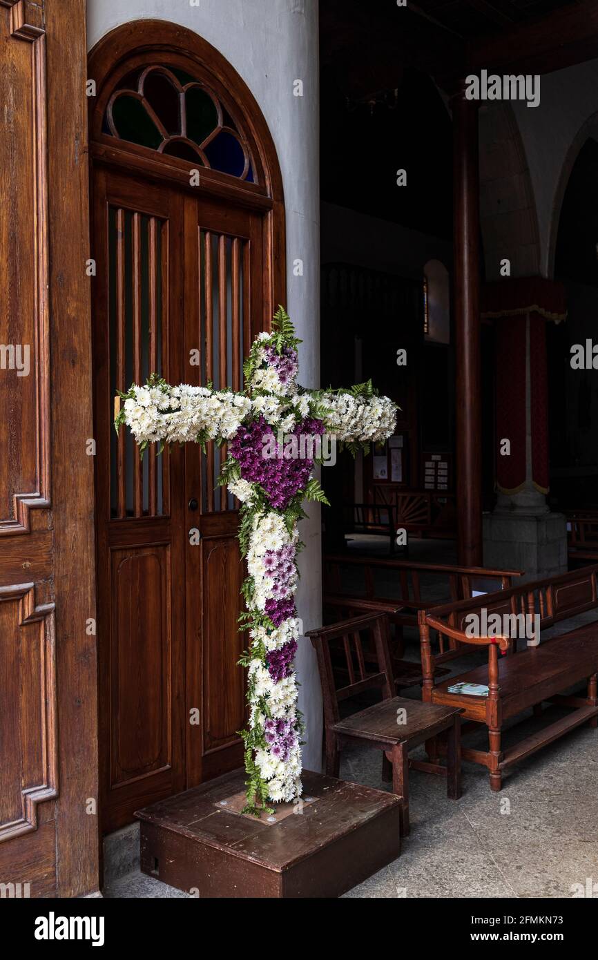 Decorated flower cross at the entrance to the catholic church, Nuestra senora de la luz, our Lady of the light, in Guia de Isora, Tenerife, Canary Isl Stock Photo