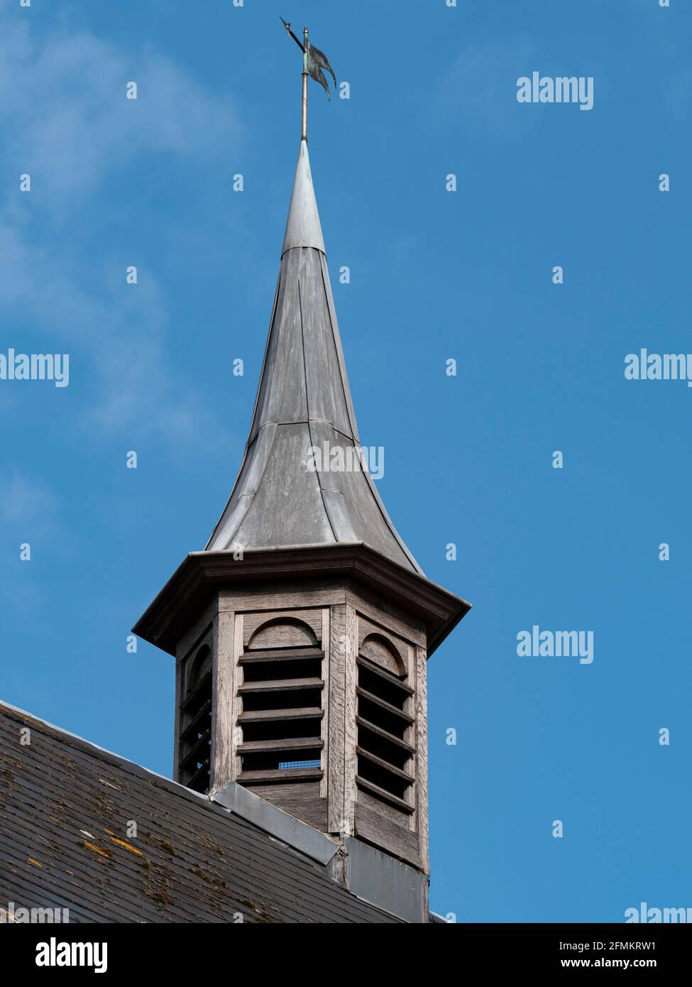 Old wooden turret with a lead roof and a blue sky as a background Stock Photo