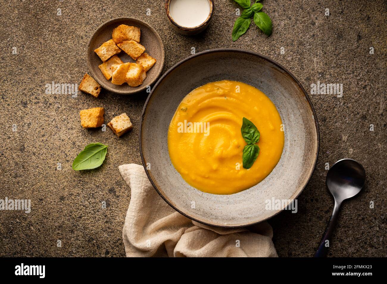 Vegetable vegetarian cream soup in a white bowl with croutons on a ...