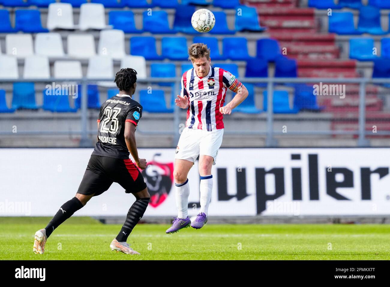 TILBURG, NETHERLANDS - MAY 9: Noni Madueke of PSV Eindhoven and Jordens Peters of Willem II during the Dutch Eredivisie match between Willem II and PS Stock Photo