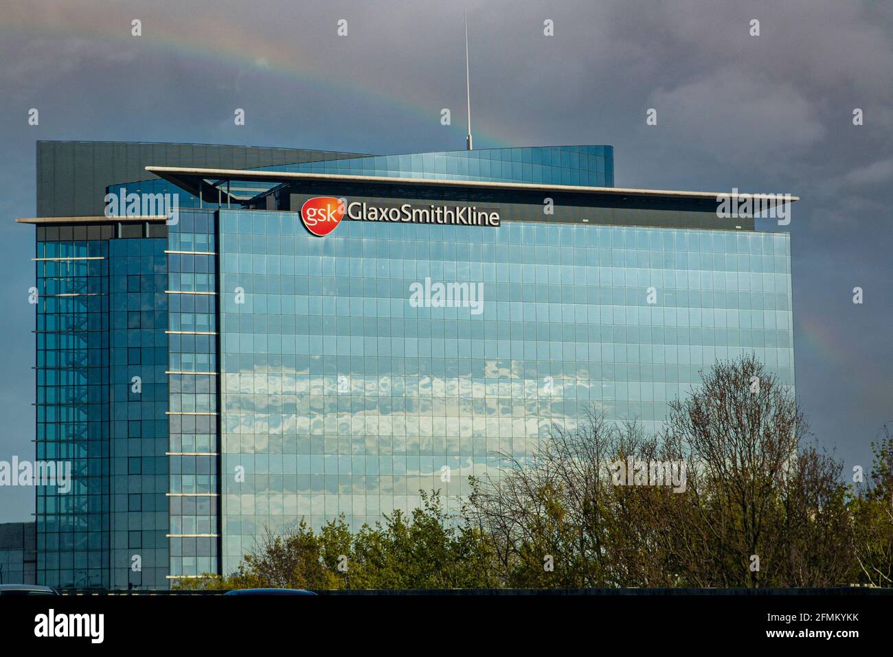 A rainbow over the Glaxo Smith Kline headquarters in London Stock Photo