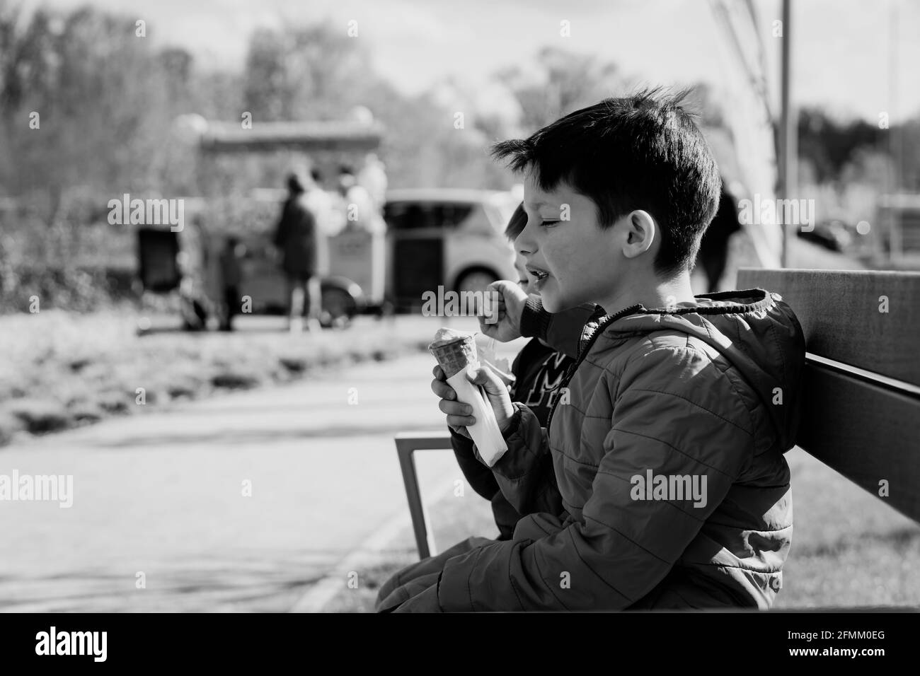 Two boys eating ice cream Black and White Stock Photos & Images - Alamy