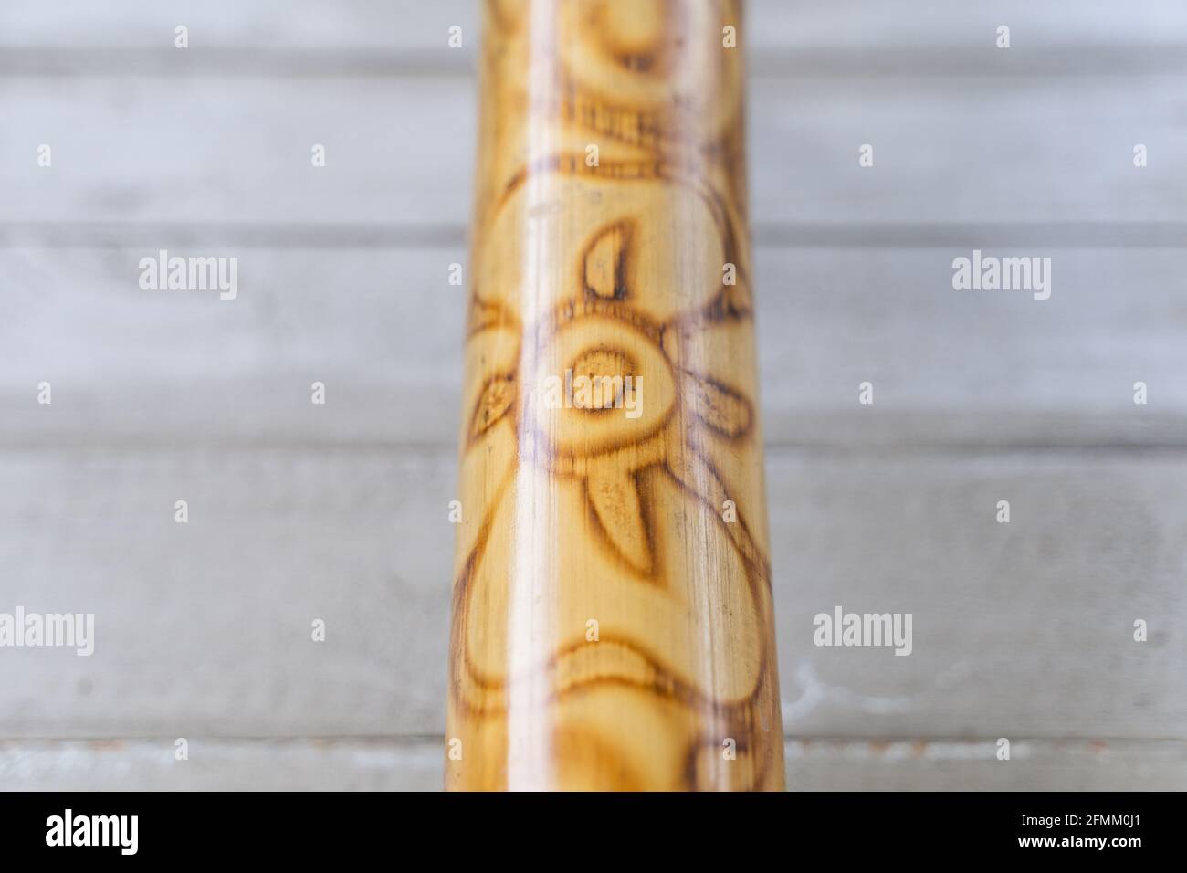 Closeup on didgeridoo music instrument with abstract design pattern