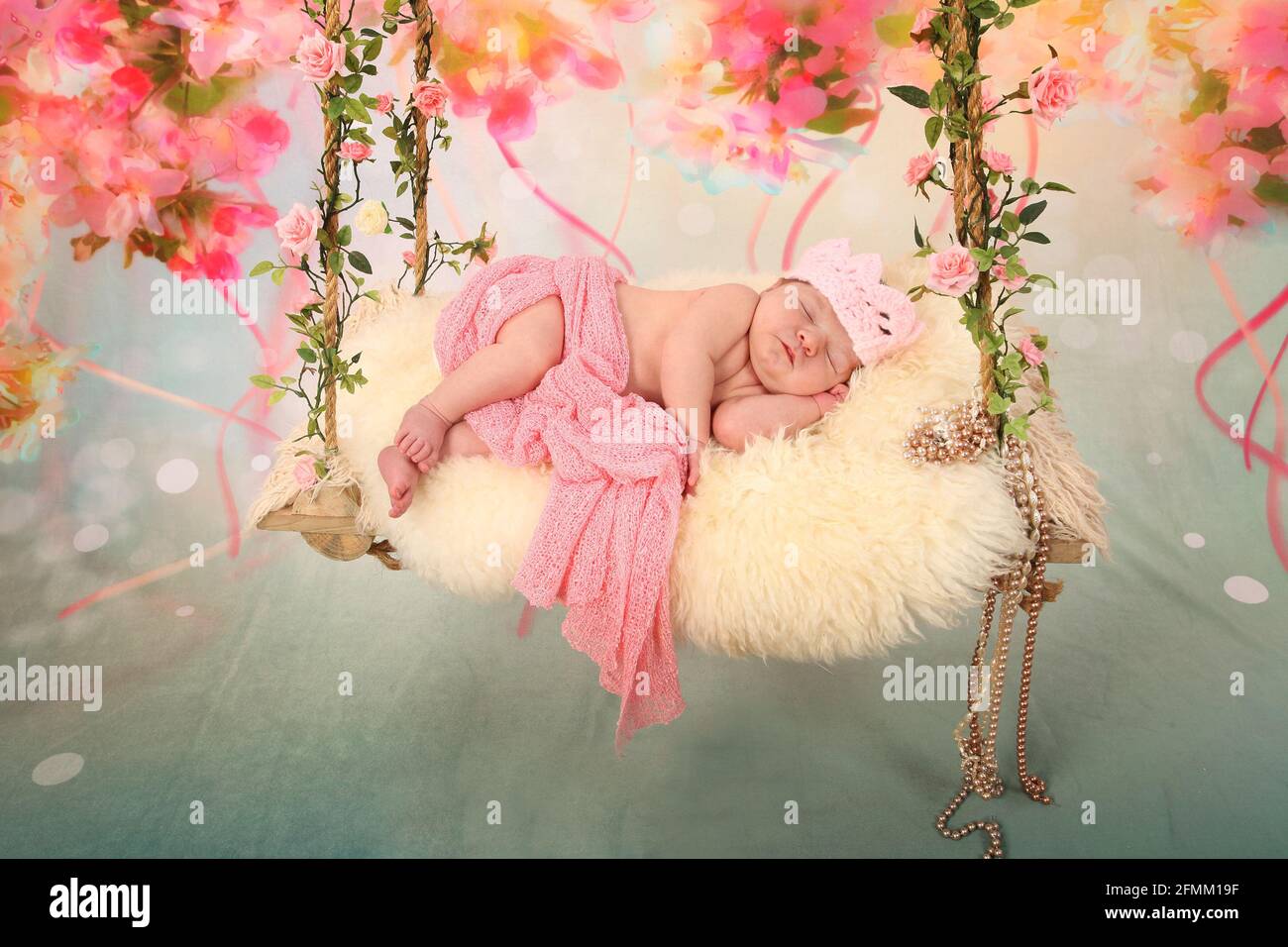 newborn Baby Sleeping on a swing, dreaming, restful sleep in a dream