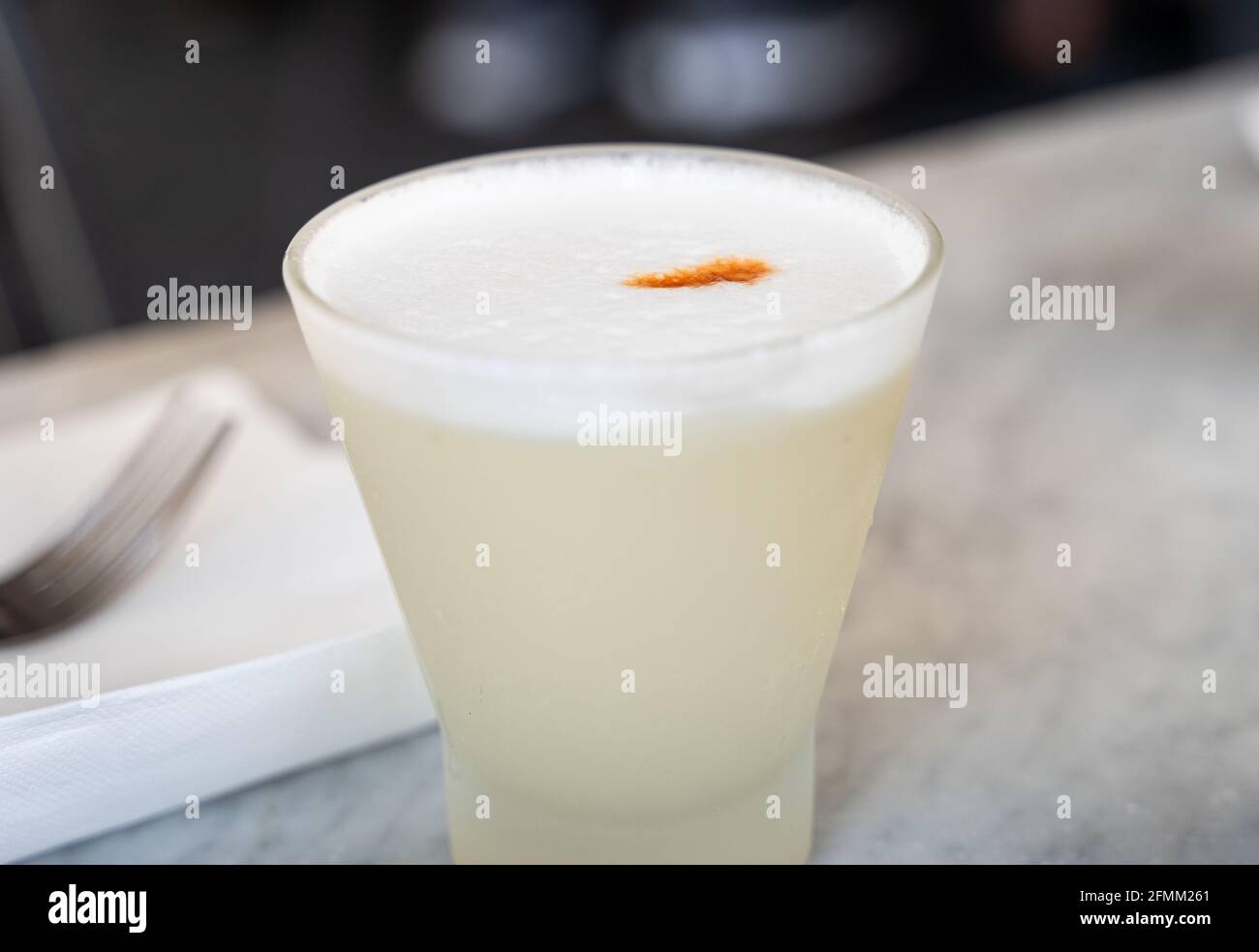 Traditional pisco sour Peruvian drink with angostura bitters on top ...