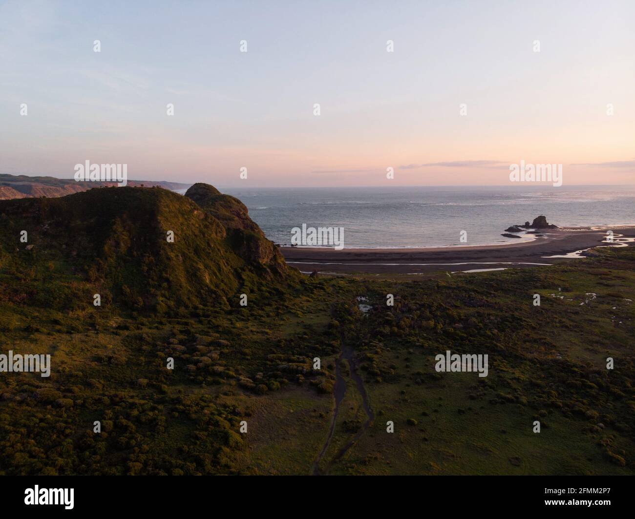 Aerial nature landscape sunset panorama at idyllic remote Whatipu beach