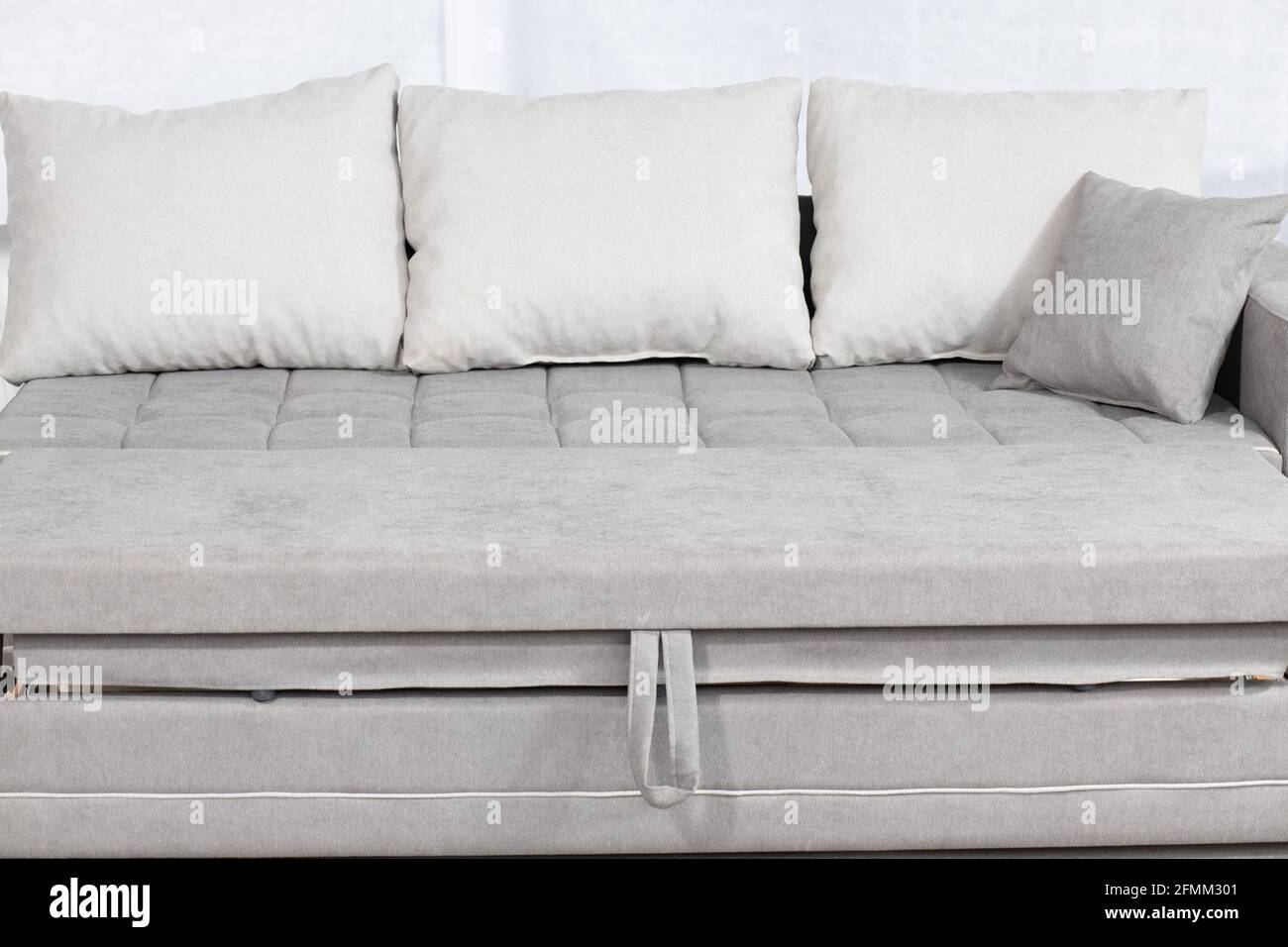 Stylish white sectional couch for a modern living room interior Stock
