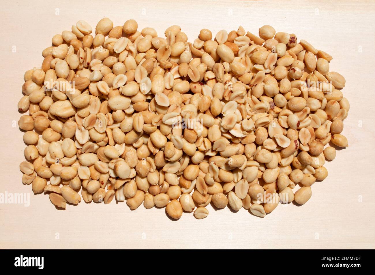 large pile heap display of fresh roasted peanut legume display on a