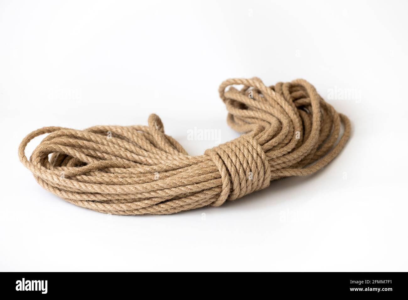 natural jute rope isolated on a white background Stock Photo - Alamy