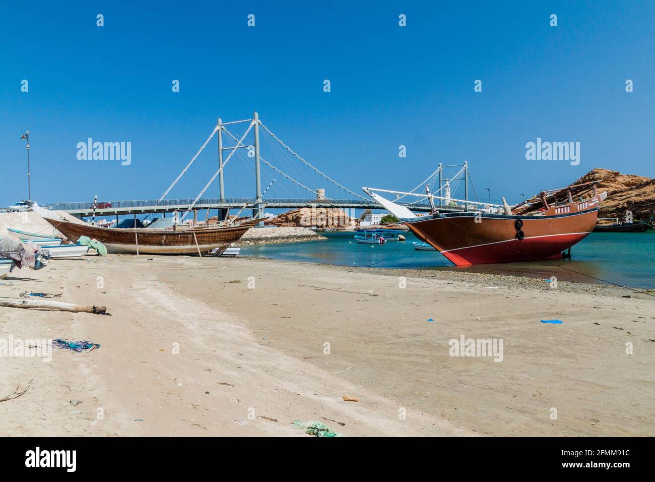 Traditional dhow boat yards in Sur, Oman. Khor al Batar bridge in the ...