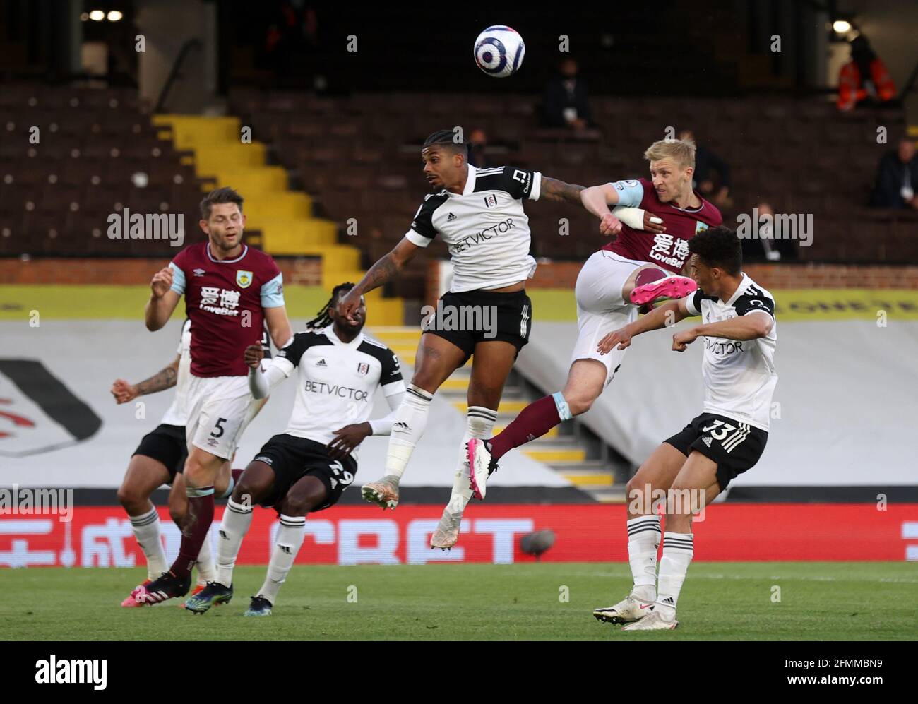 Burnley's Ben Mee heads towards goal during the Premier League match at Craven Cottage, London. Picture date: Monday May 10, 2021. Stock Photo