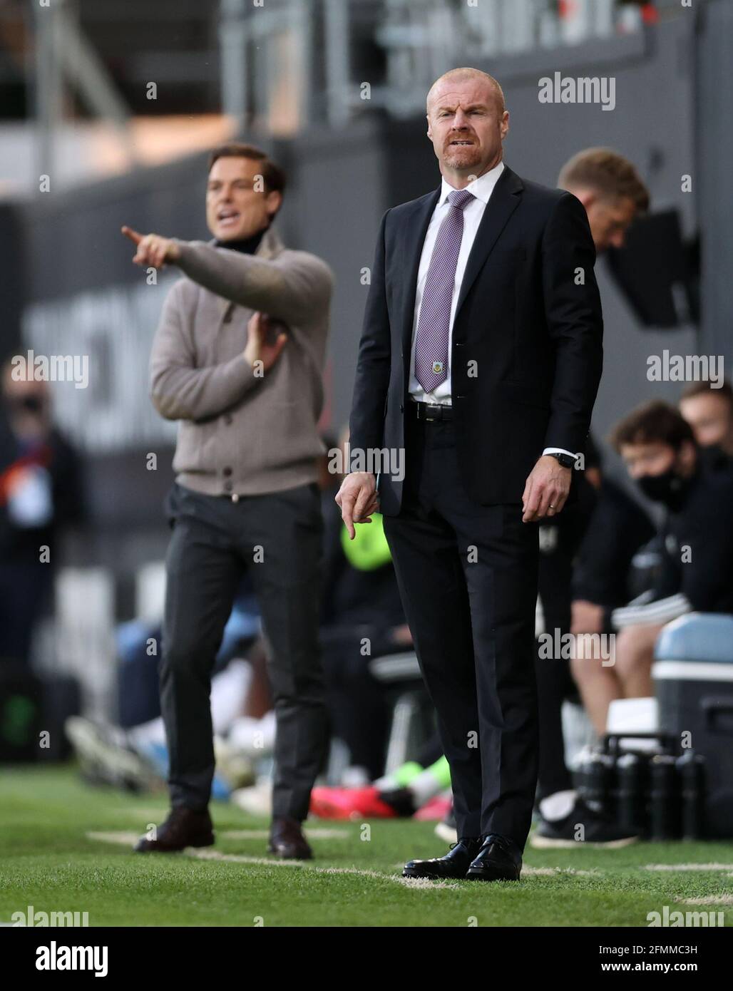 Fulham manager Scott Parker and Burnley manager Sean Dyche on the touchline during the Premier League match at Craven Cottage, London. Picture date: Monday May 10, 2021. Stock Photo