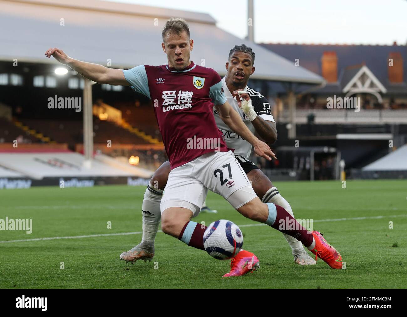 Burnley's Matej Vydra and Fulham's Mario Lemina (right) battle for the ball during the Premier League match at Craven Cottage, London. Picture date: Monday May 10, 2021. Stock Photo