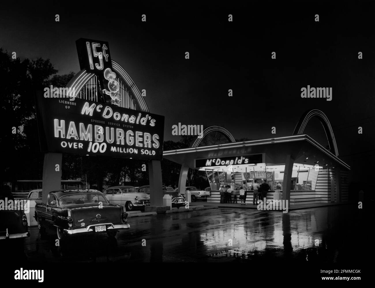A photograph of a classic 1950s McDonald's fast food drive-in restaurant photographed in 1959 and colorized for artist effect. Stock Photo
