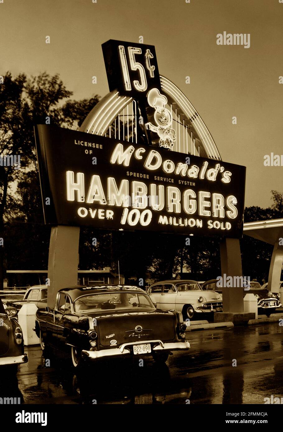 A photograph of a classic 1950s McDonald's fast food drive-in restaurant photographed in 1959 and colorized for artist effect. Stock Photo