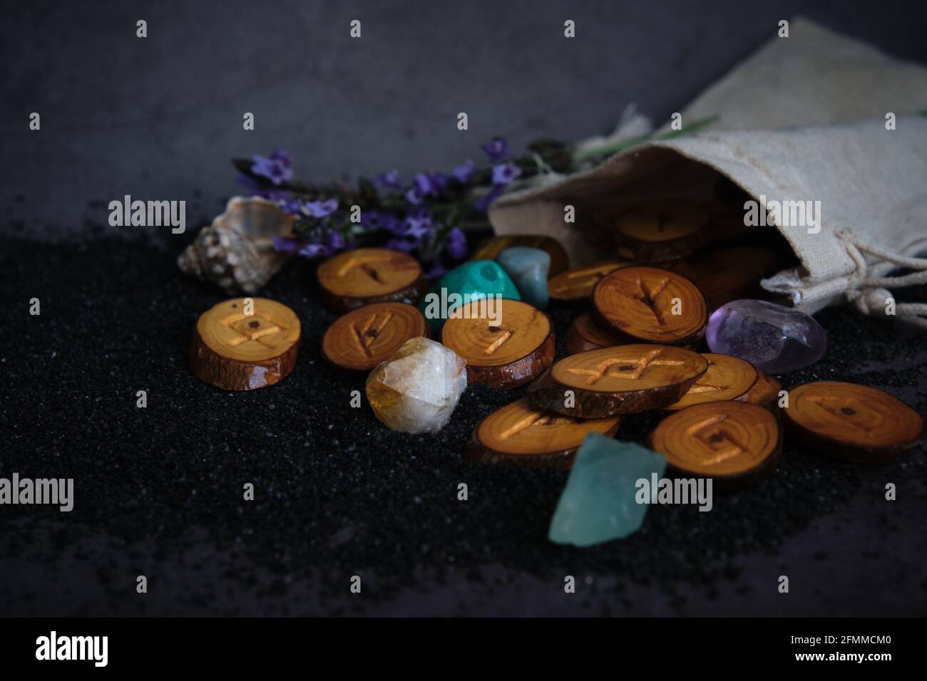 homemade wooden runes on a dark background Stock Photo - Alamy