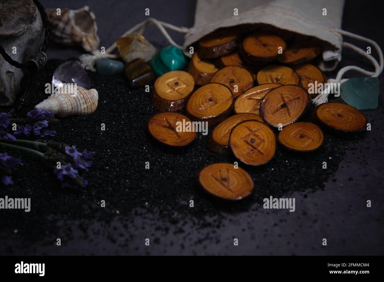 homemade wooden runes on a dark background Stock Photo - Alamy