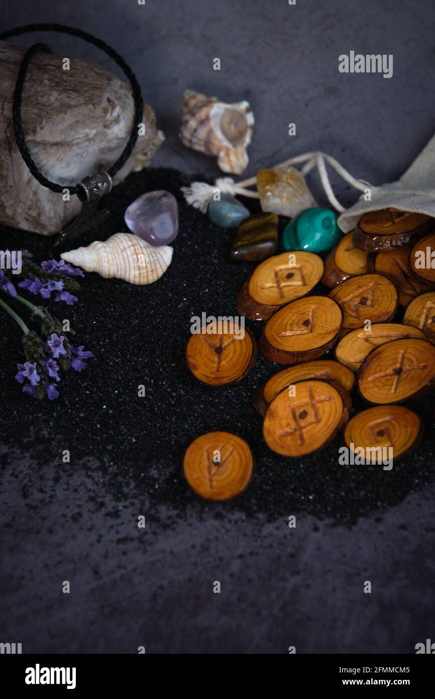 homemade wooden runes on a dark background Stock Photo - Alamy