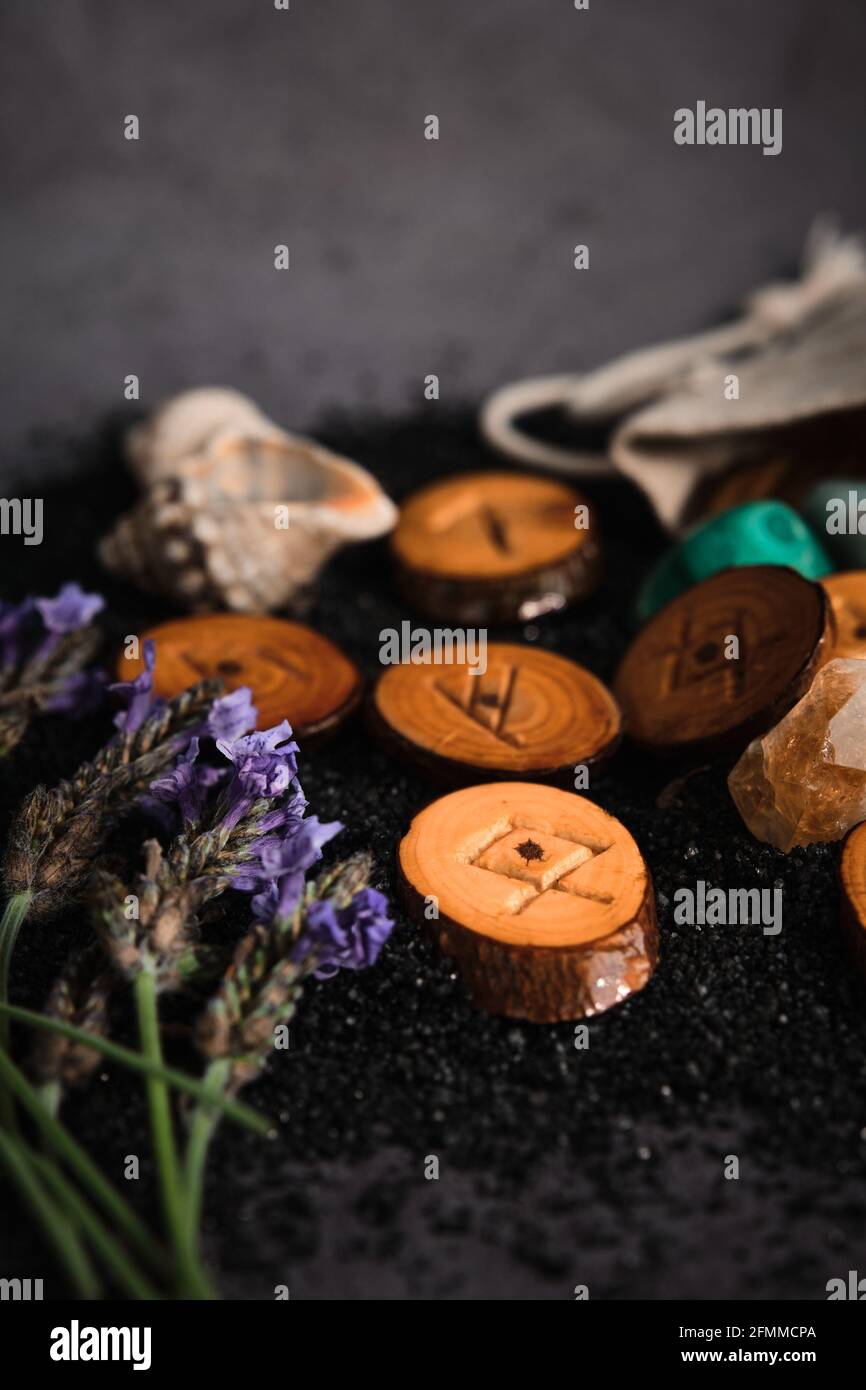 homemade wooden runes on a dark background Stock Photo - Alamy