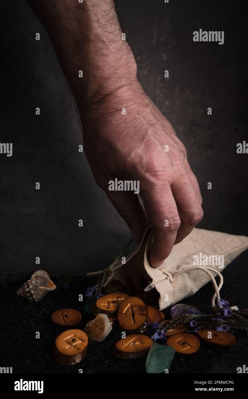 homemade wooden runes on a dark background Stock Photo - Alamy