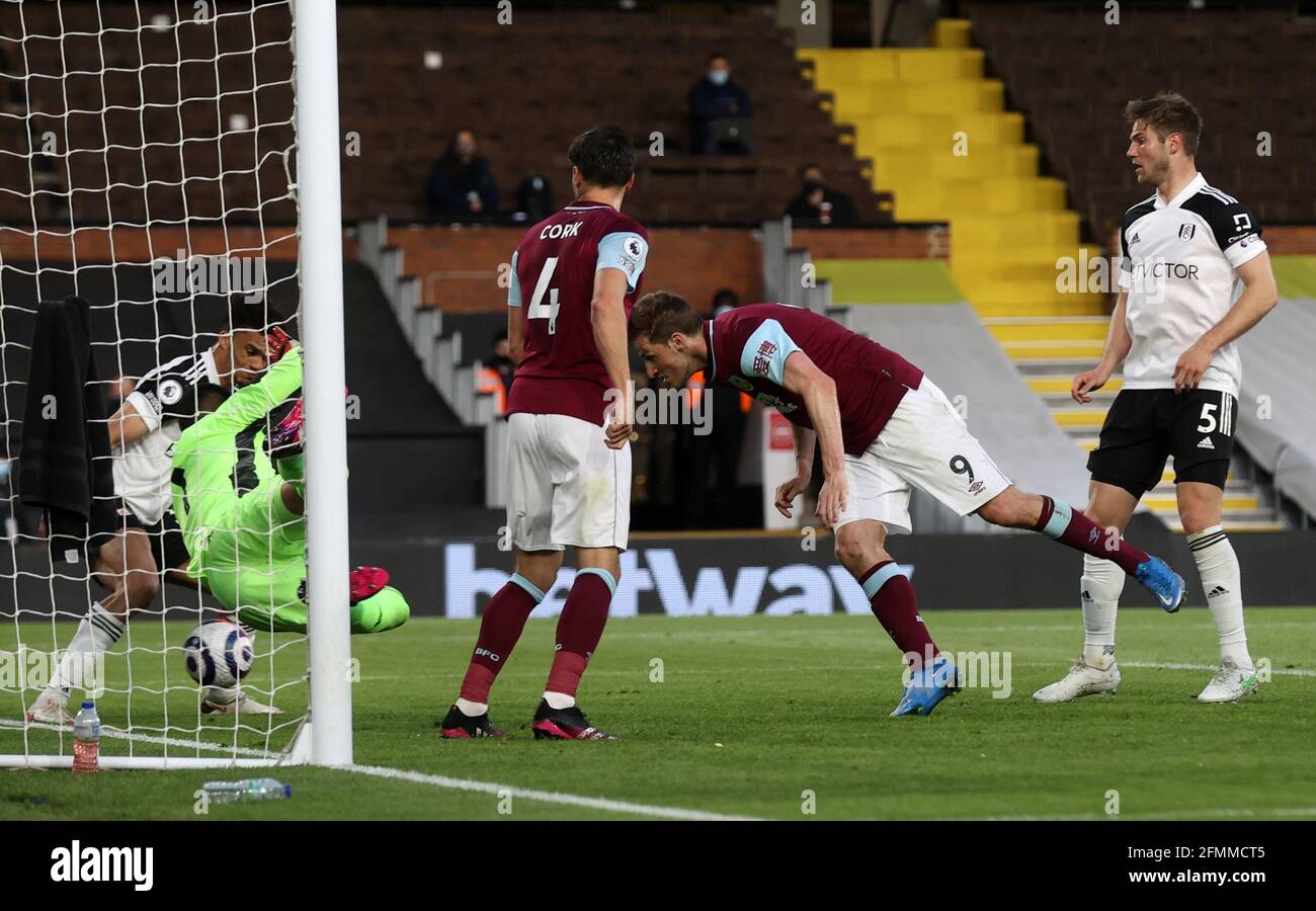 Burnley's Chris Wood has his header saved by Fulham goalkeeper Alphonse Areola during the Premier League match at Craven Cottage, London. Picture date: Monday May 10, 2021. Stock Photo