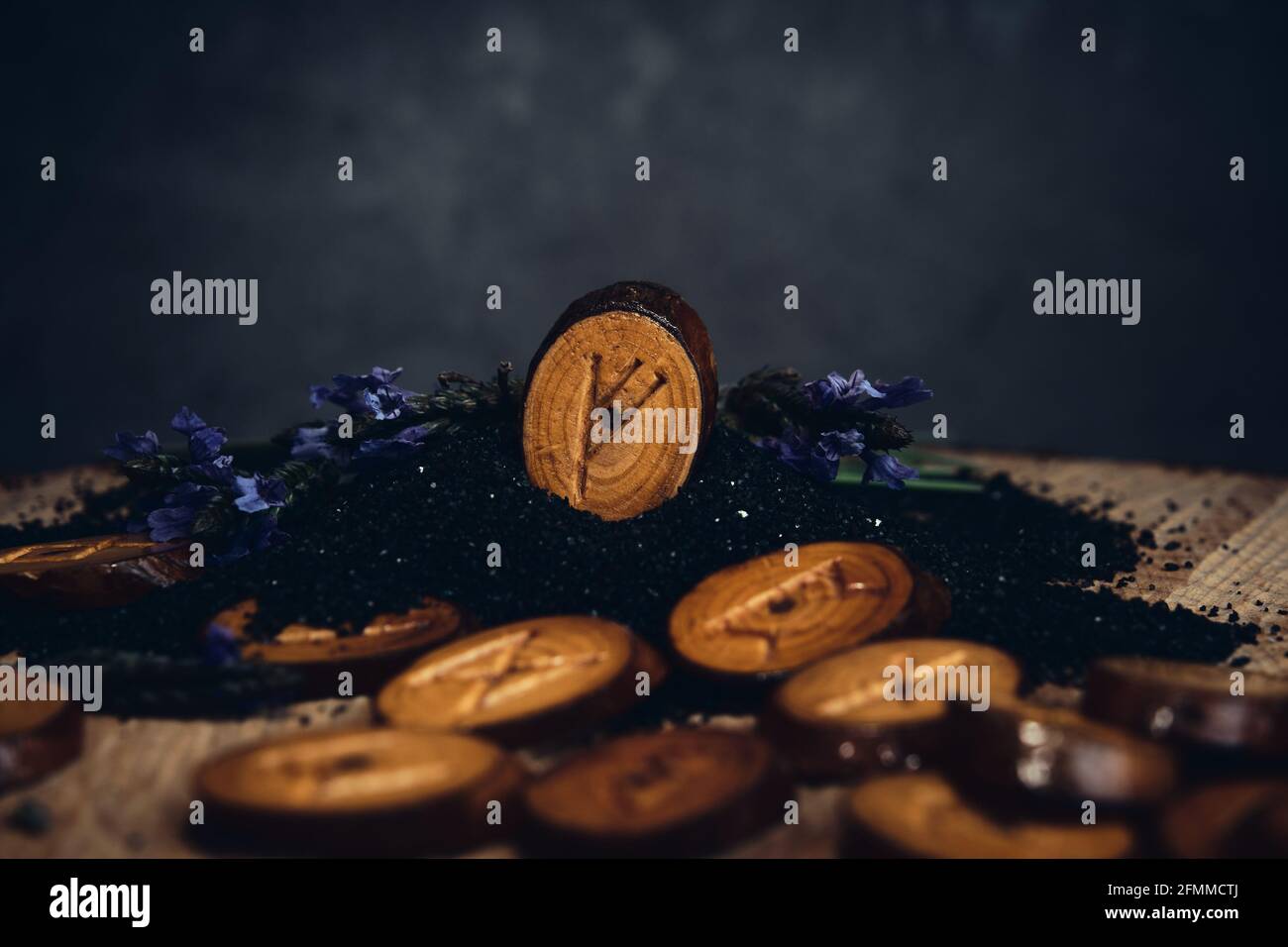 homemade wooden runes on a dark background Stock Photo - Alamy