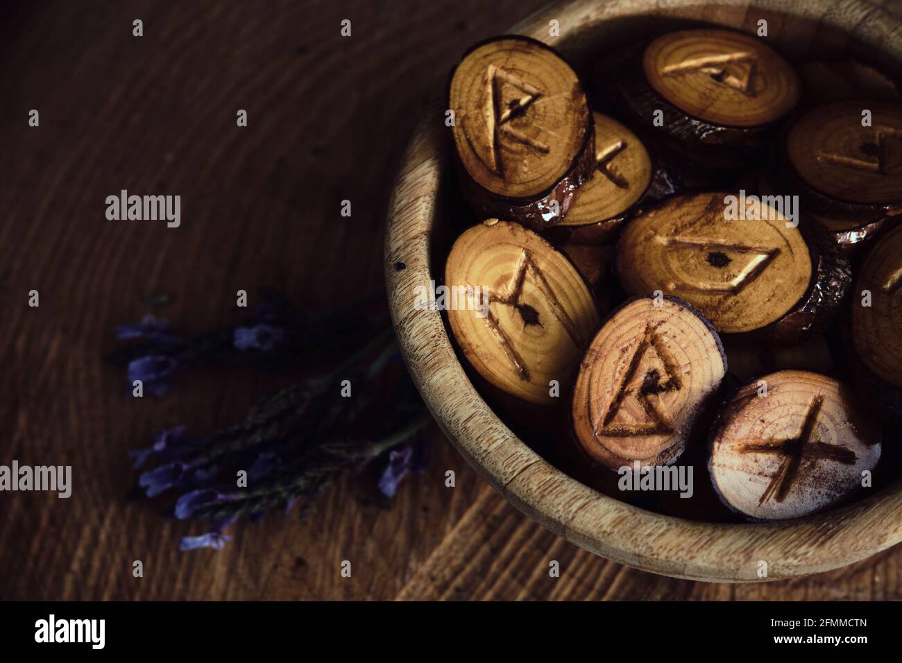 homemade wooden runes on a dark background Stock Photo - Alamy