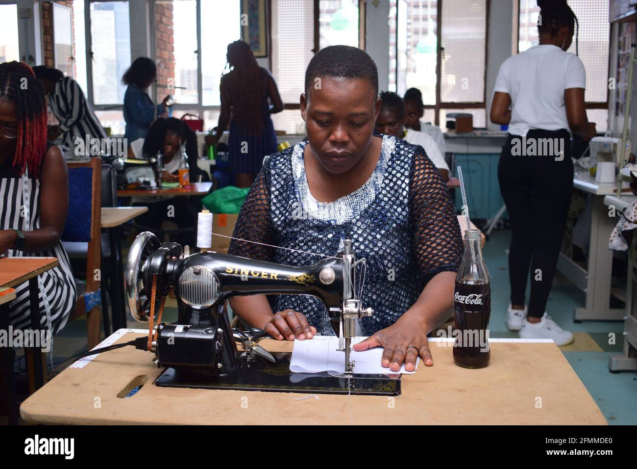 Dressmaker work on the sewing machine Stock Photo - Alamy