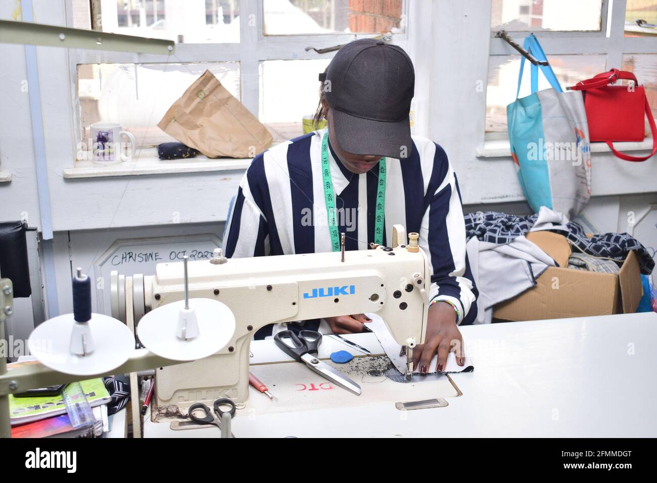 Dressmaker work on the sewing machine Stock Photo - Alamy