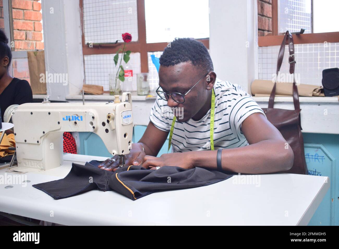 Dressmaker work on the sewing machine Stock Photo - Alamy