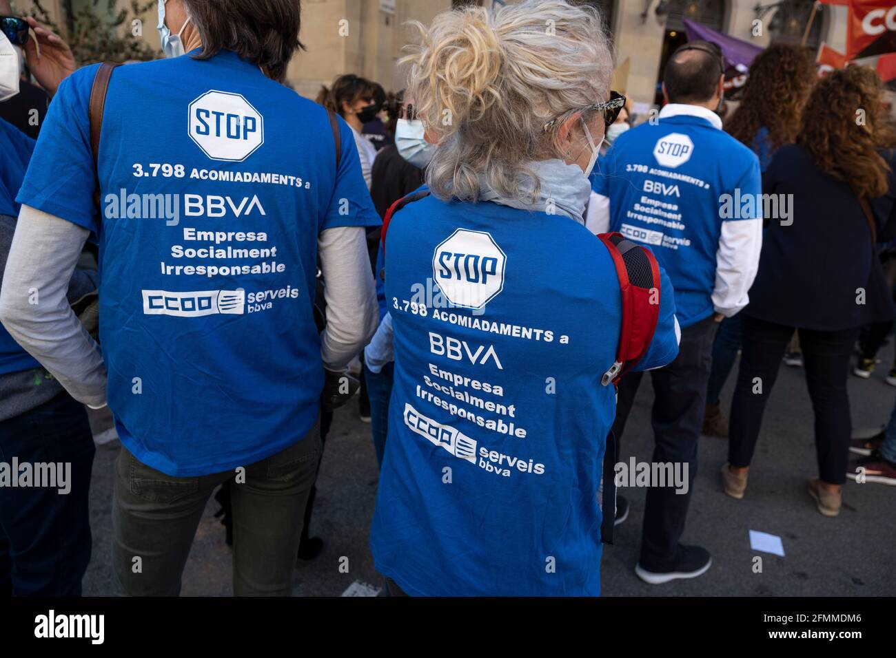 Barcelona, Spain. 10th May, 2021. Protesters seen wearing blue shirts labeled against the 3,798 layoffs during the demonstration.Summoned by the banking unions, hundreds of Banco Bilbao Vizcaya Argentaria (BBVA) bank workers have gathered in front of the headquarters in Vía Laietana to protest the Employment Regulation File (ERE) that the entity wants to apply with the dismissal of more than 3,000 workers. (Photo by Paco Freire/SOPA Images/Sipa USA) Credit: Sipa USA/Alamy Live News Stock Photo