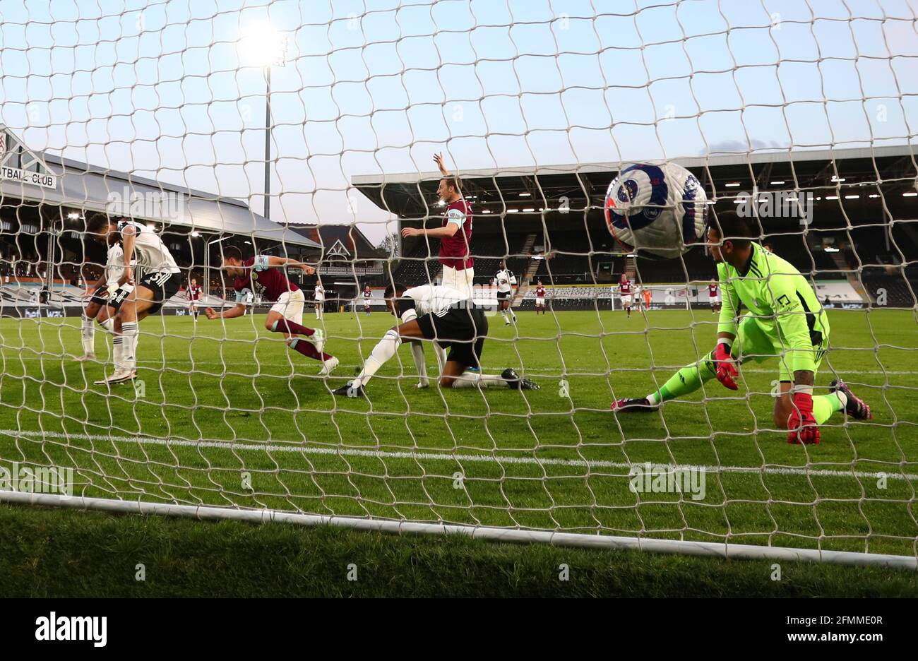 Burnley's Ashley Westwood scores their side's first goal of the game during the Premier League match at Craven Cottage, London. Picture date: Monday May 10, 2021. Stock Photo
