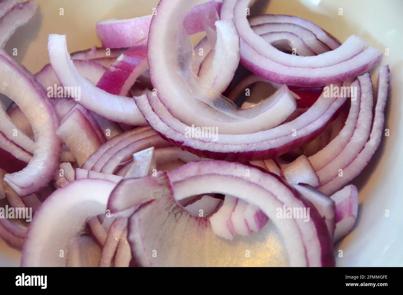 freshly sliced red onions, cooking ingredients for salad recipe Stock Photo