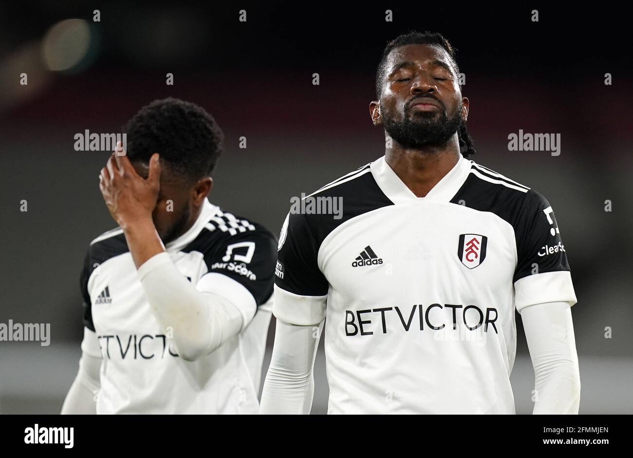 Fulham S Andre Frank Zambo Anguissa Looks Dejected After Fulham Are Relegated During The Premier League Match At Craven Cottage London Picture Date Monday May 10 21 Stock Photo Alamy