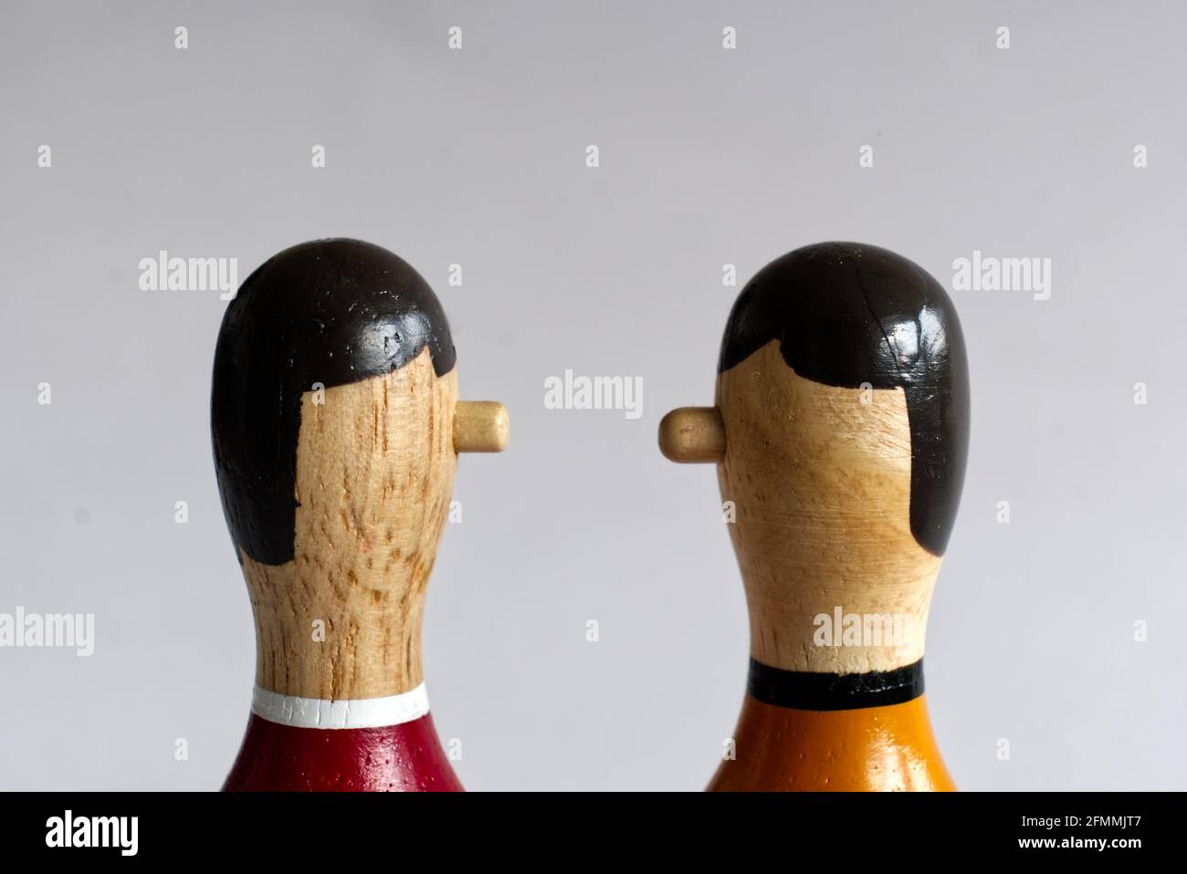 narrow countershot of a dialogue between two wooden puppets Stock Photo