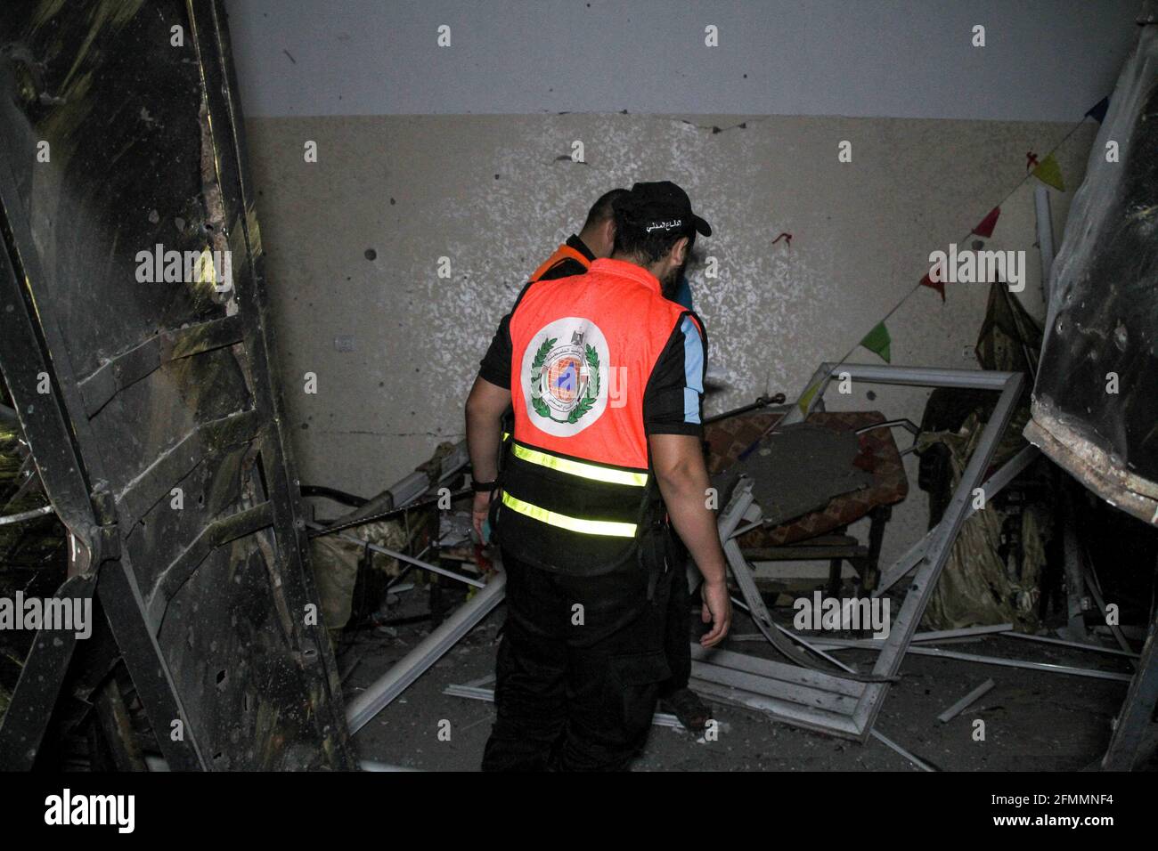 Gaza, Palestine. 10 May 2021. Rescue teams of the Palestinian Civil Defence inspect the damage to Palestinian homes in the town of Beit Hanoun caused by Israeli airstrikes on the Gaza Strip. Twenty Palestinians were killed in a series of Israeli airstrikes on the Gaza Strip on Monday which came after Hamas launched rockets from the coastal territory towards Israel, including Jerusalem. The rockets and airstrikes followed attacks by Israeli police against Palestinian worshippers at the Al-Aqsa Mosque in recent days and consequent clashes at the al-Aqsa compound and in East Jerusal Stock Photo