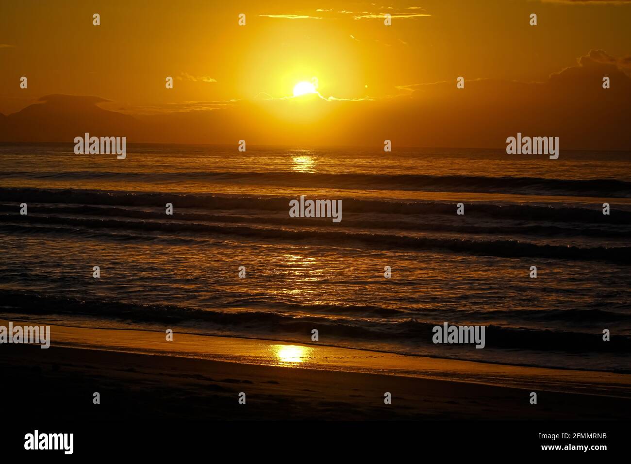 Por do sol na praia lindo. Stock Photo