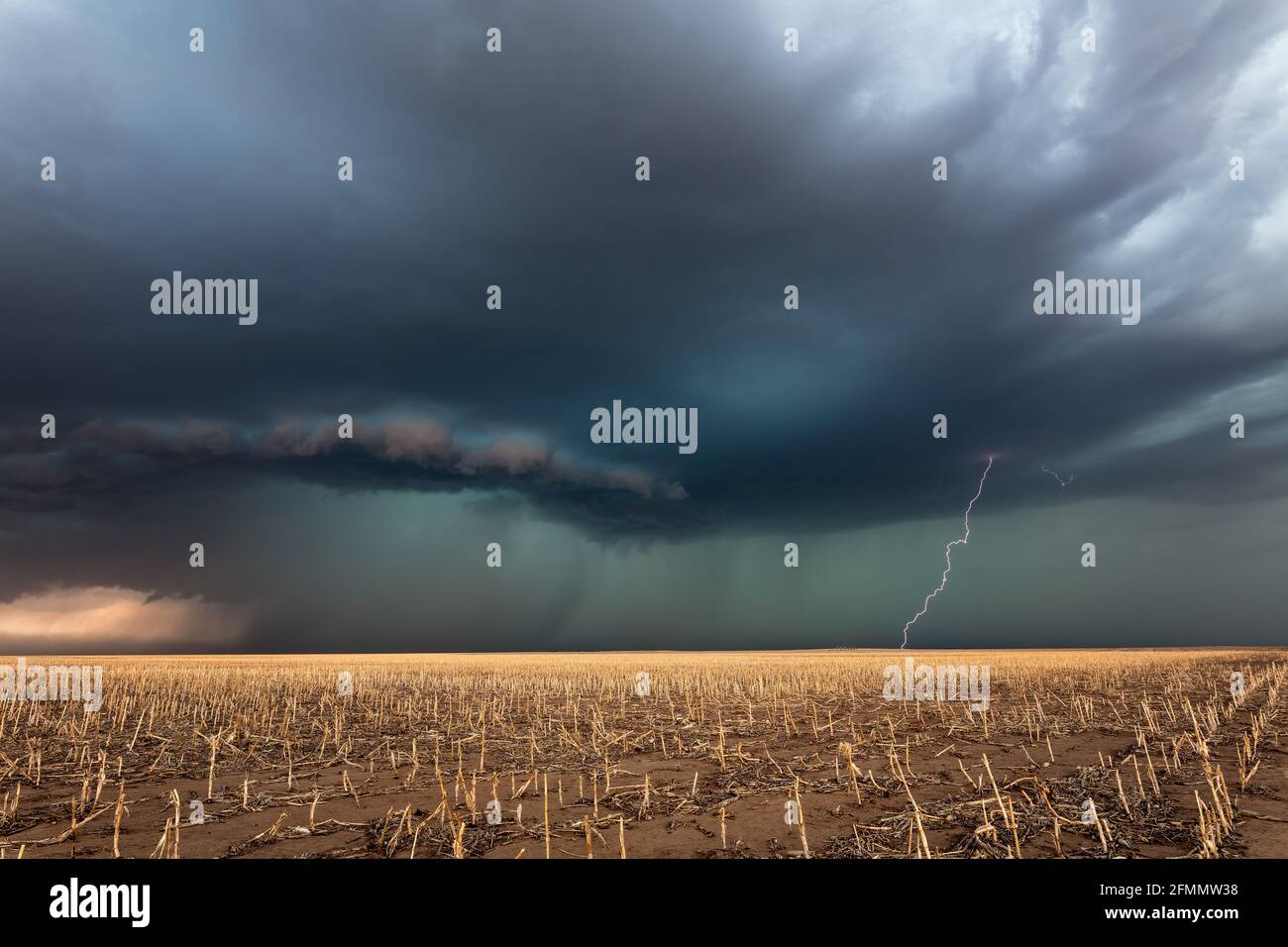 Lightning strike from a severe thunderstorm with ominous storm clouds near Colby, Kansas Stock Photo