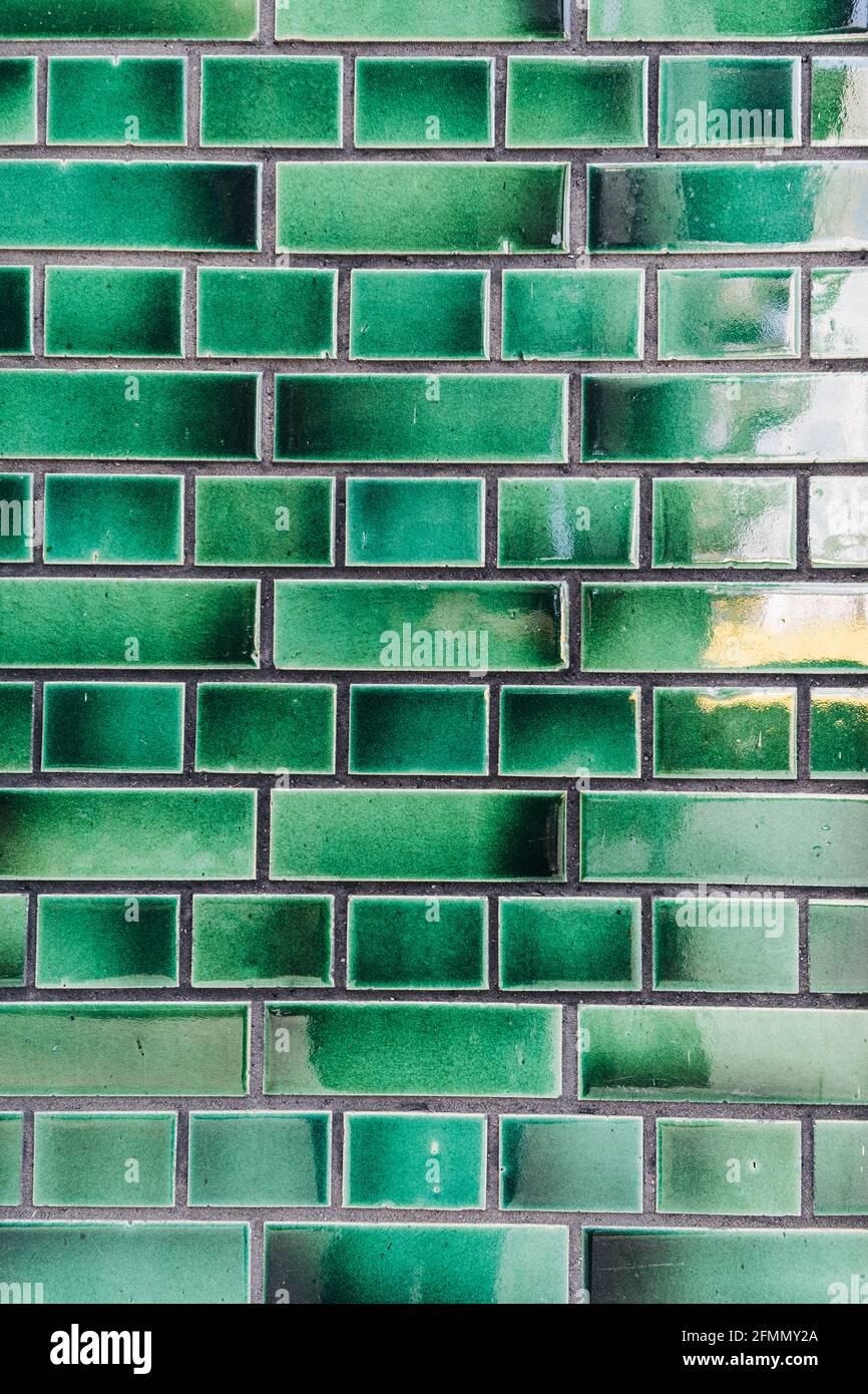 Vertical shot of an old green brick wall background Stock Photo - Alamy