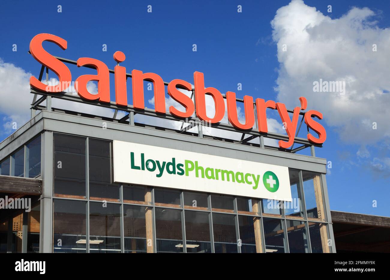 Sainsbury's and LloydsPharmacy, supermarket,  shop front, logo, sign, Kings Lynn, Norfolk, England Stock Photo